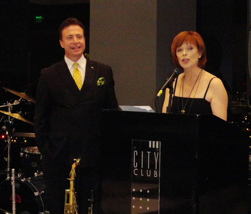 Frank Mottek MC-ing grand opening of new City Club with actress Frances Fisher.JPG
